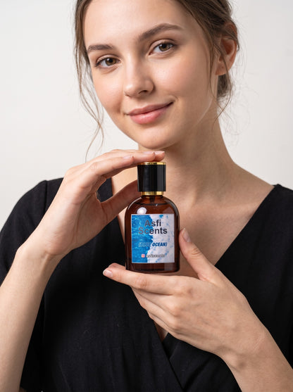 Model holding Blue Ocean by Asfi Scents